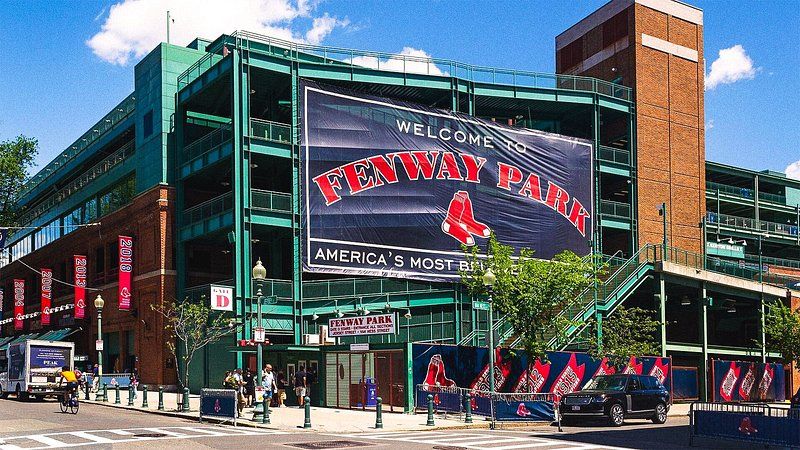 Exterior of Fenway Park, with large canvas sign over it