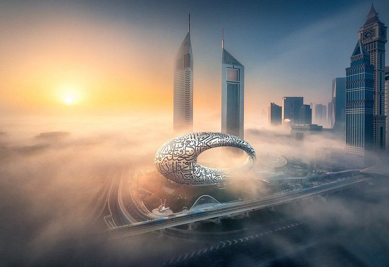 The exterior of Museum of the Future in a swirl of low clouds